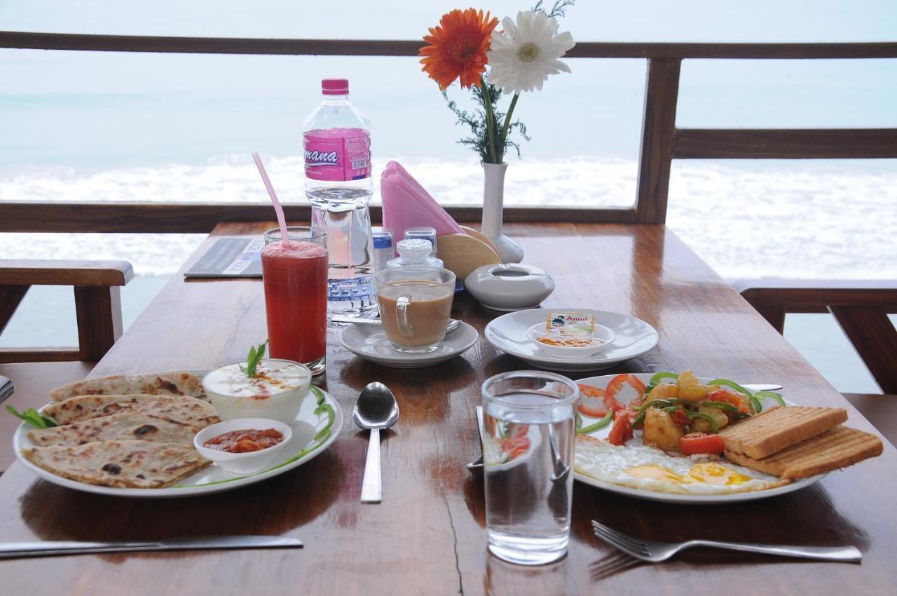 Black Beach Resort Varkala Bagian luar foto